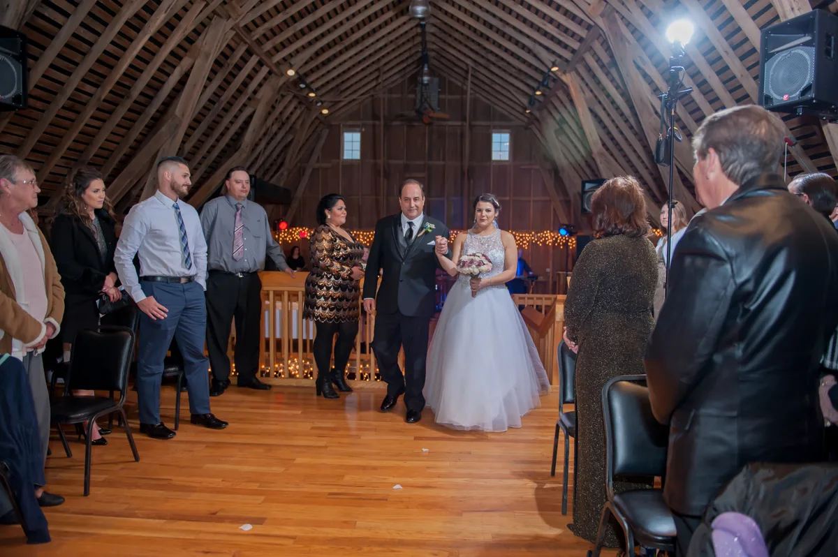 Couple embracing during an emotional first look in a garden
