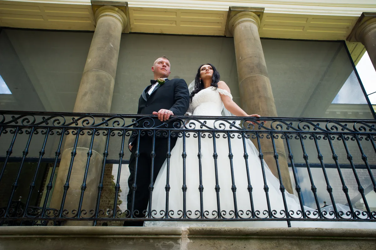 Couple on the stone terrace at Greystone Mansion with Beverly Hills views