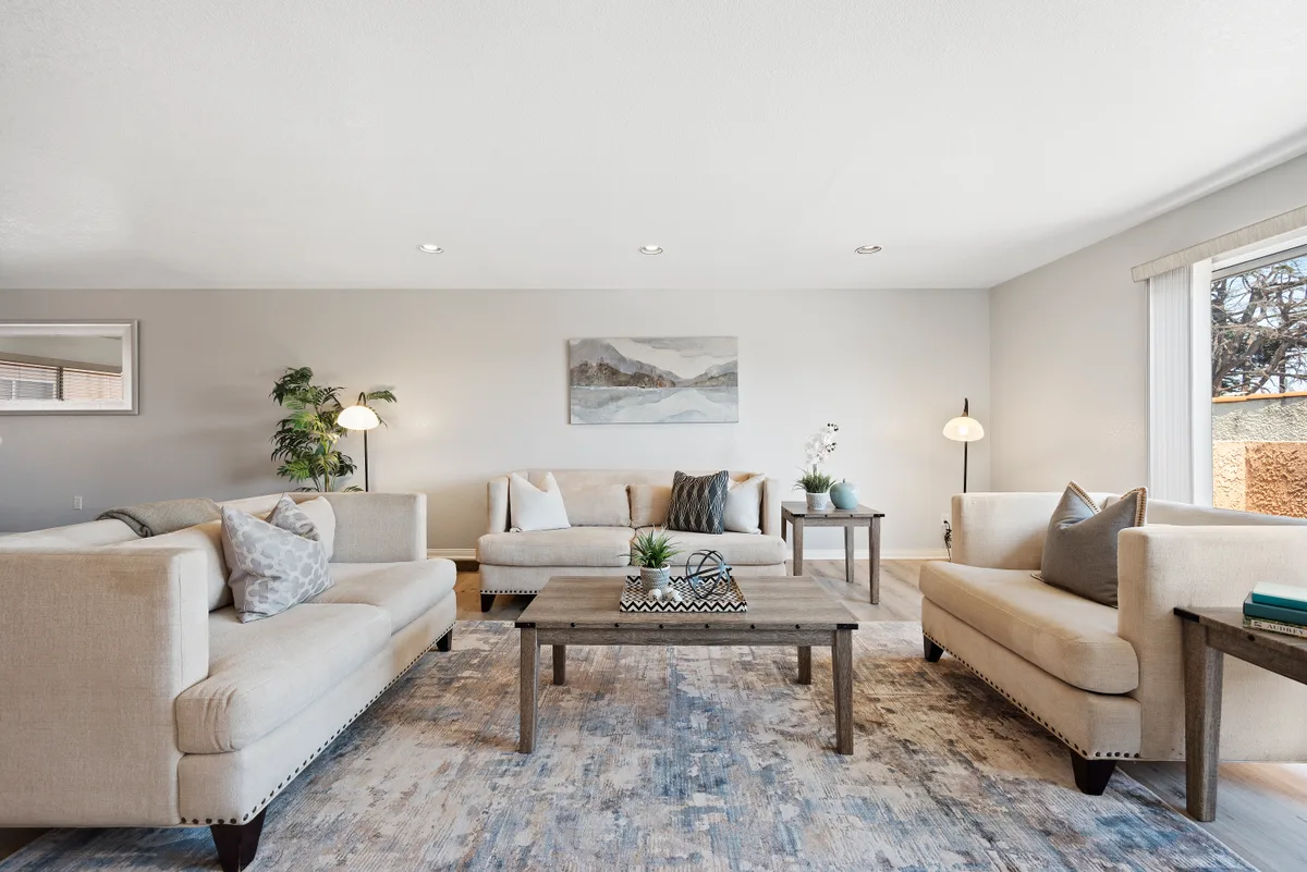 Living room with all lights on and blinds open before a shoot