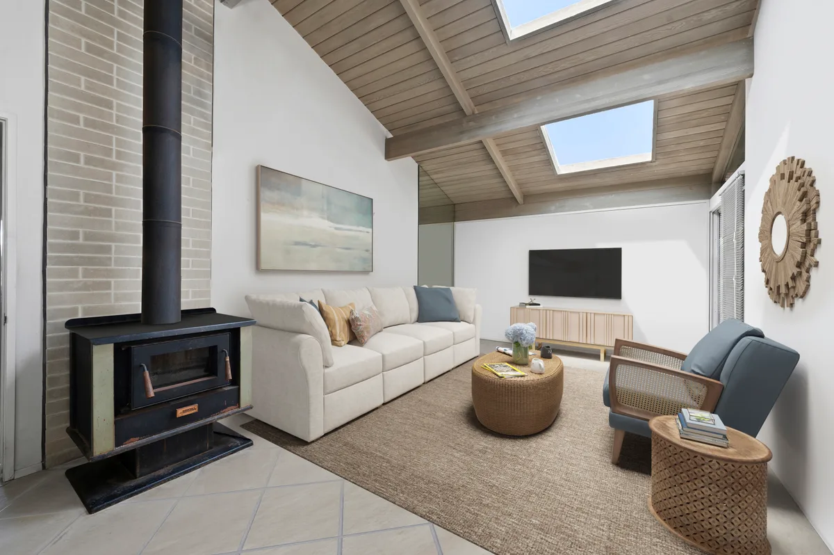 Virtually staged dining area with disclosure watermark visible