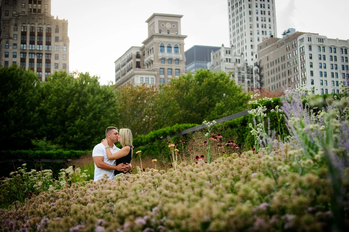 Romantic golden hour engagement portrait in a field